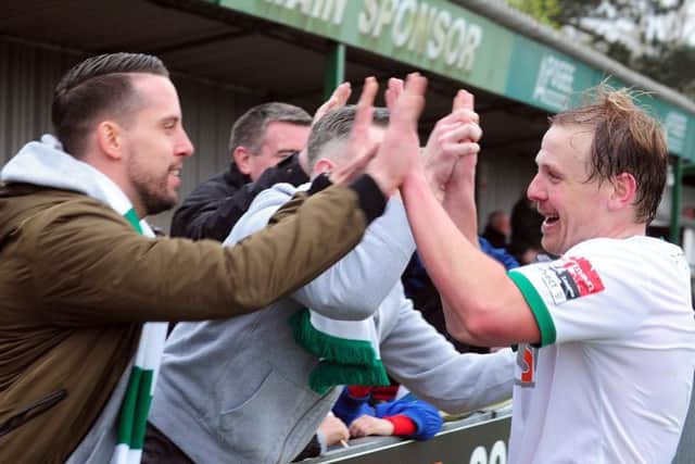 James Fraser celebrates one of his goals with fans / Picture by Kate Shemilt